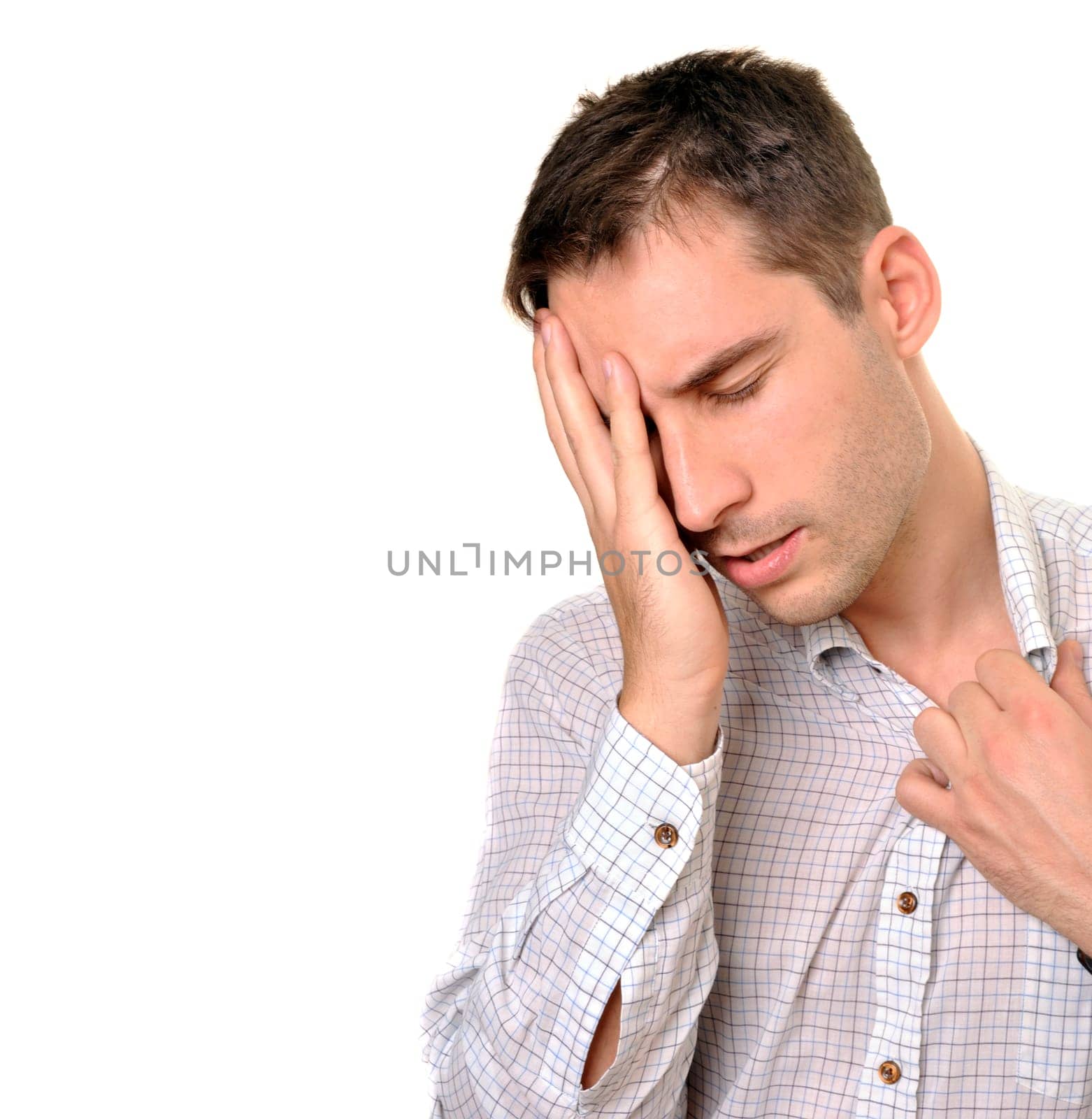 young businessman under stress isolated over white