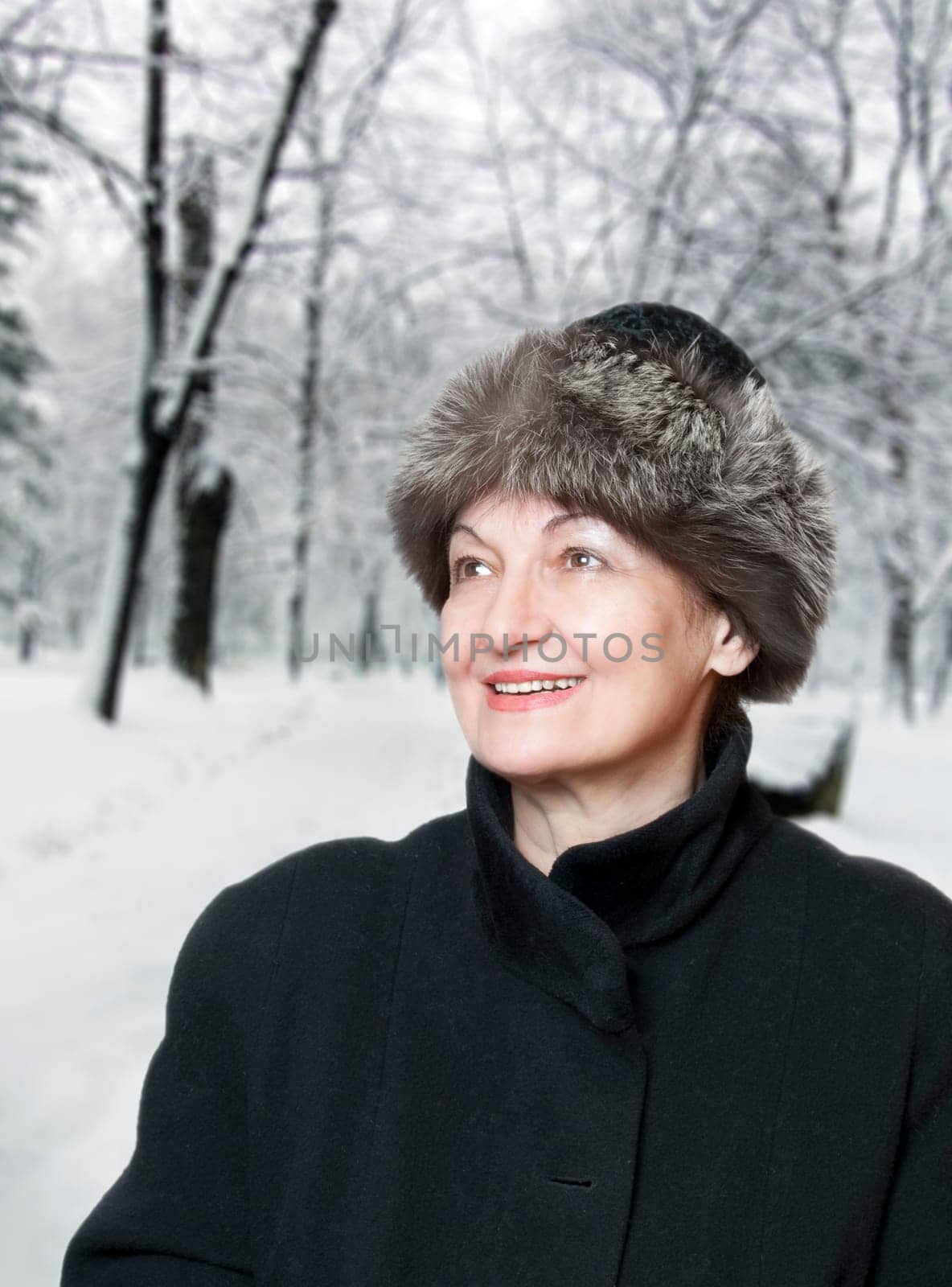 Happy elderly woman enjoy the winter