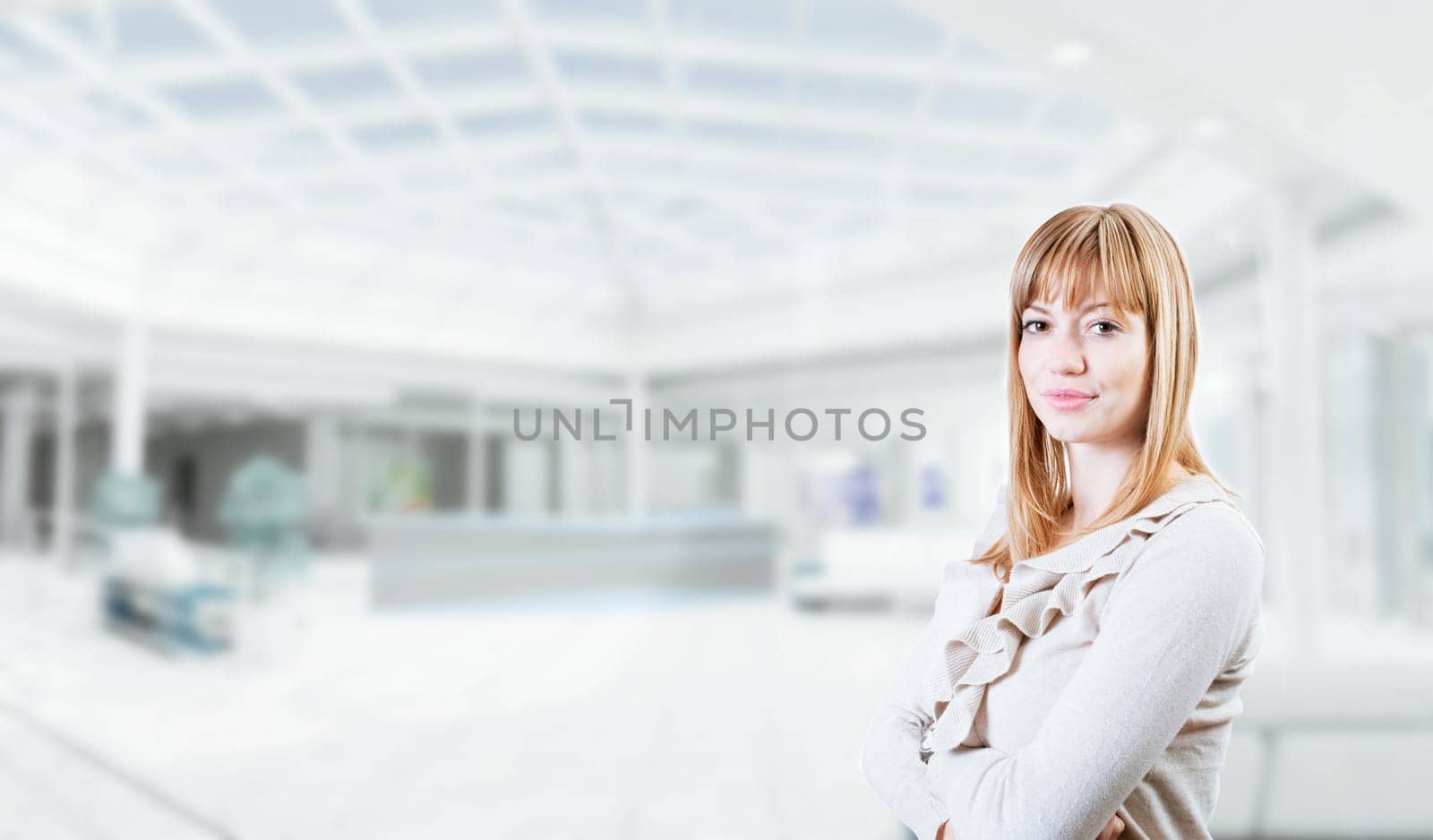 Portrait of a young attractive business woman in corporate building