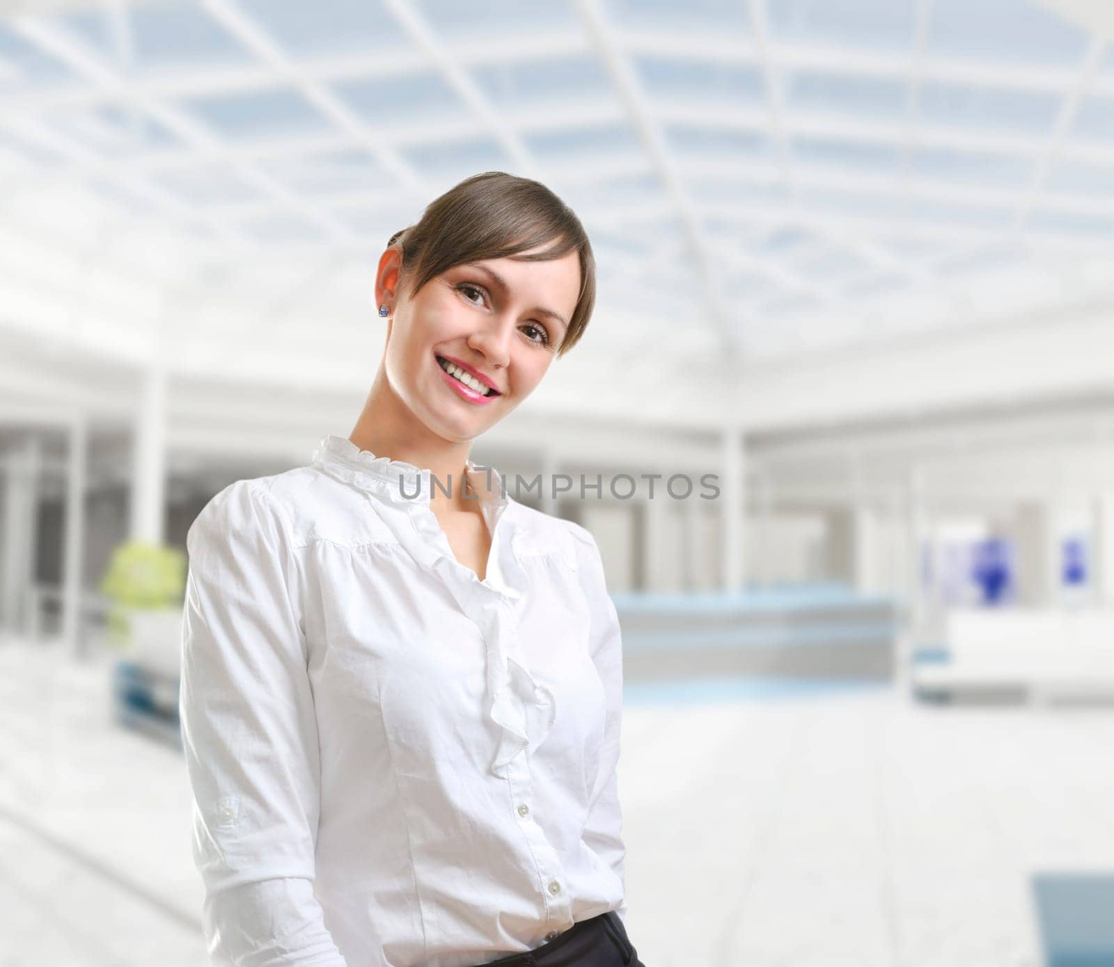 Portrait of a young attractive business woman in corporate building