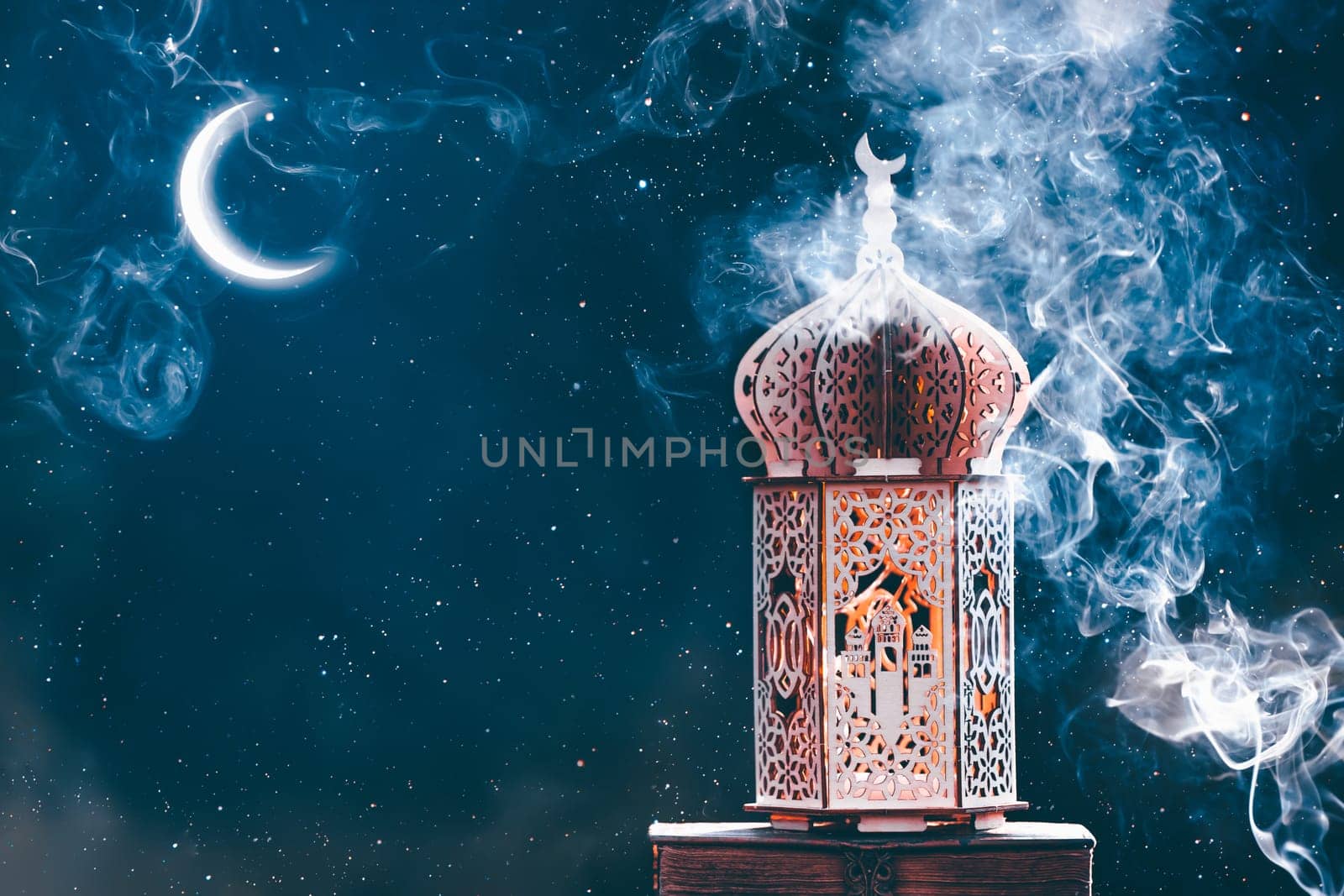 Ornamental Arabic lantern with crescent moon glowing at night. Festive greeting card for Muslim holy month Ramadan Kareem.