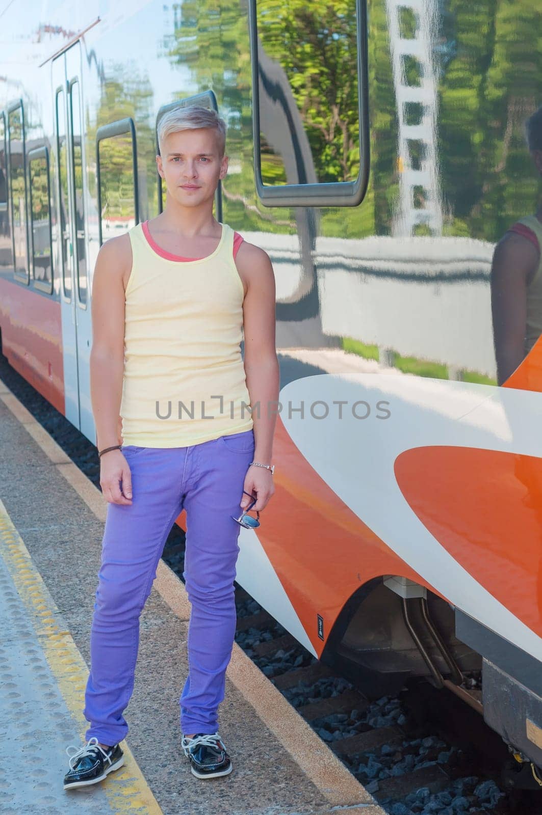 Young man on the background of the train