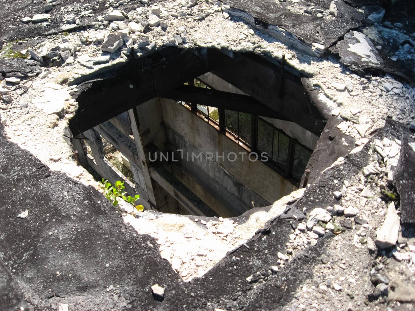 round hole in the roof of the old building. Abandoned industrial building.