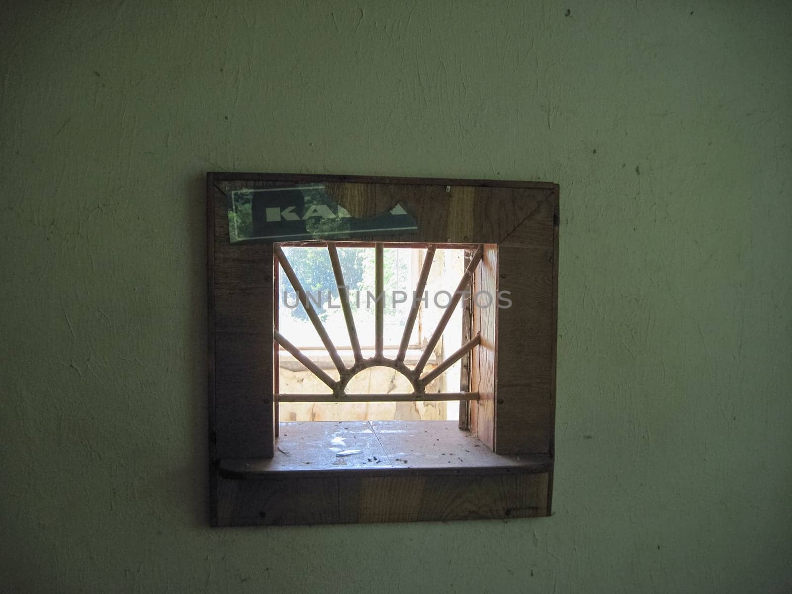 The window of issuing money at the cash register. Abandoned building. Soviet ruins.