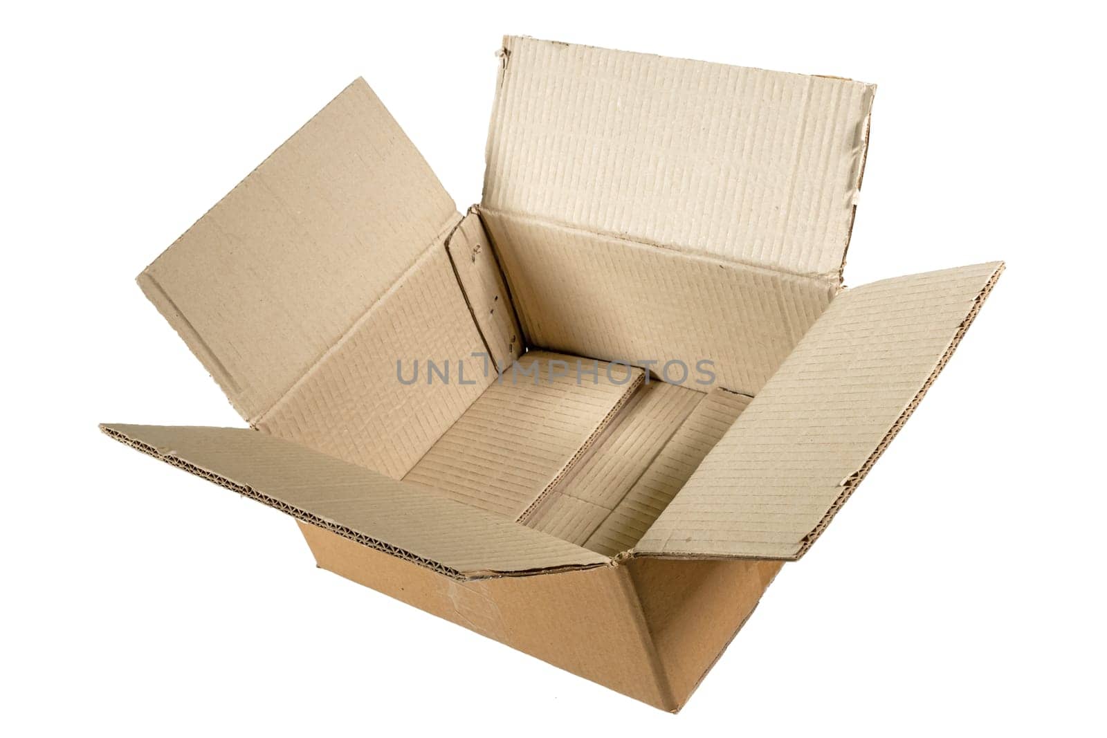 Side view of an unfolded empty cardboard box isolated on white