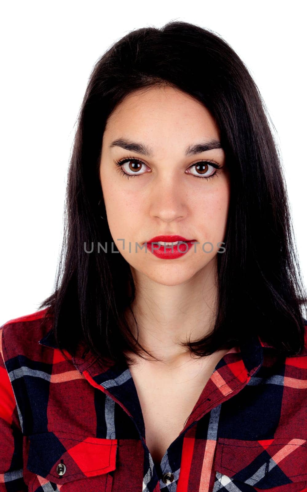 Serious brunette girl with red plaid shirt isolated on a white background