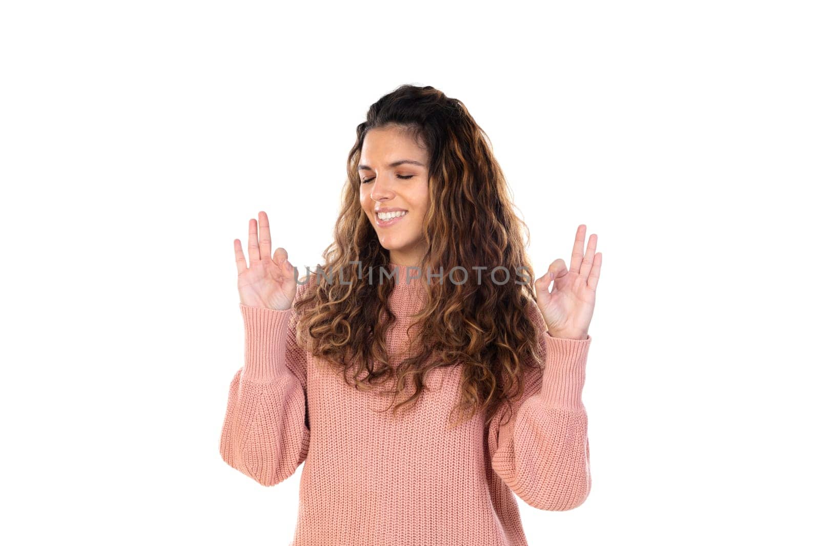 Beautiful middle aged woman with pink woolen sweater isolated on a white background
