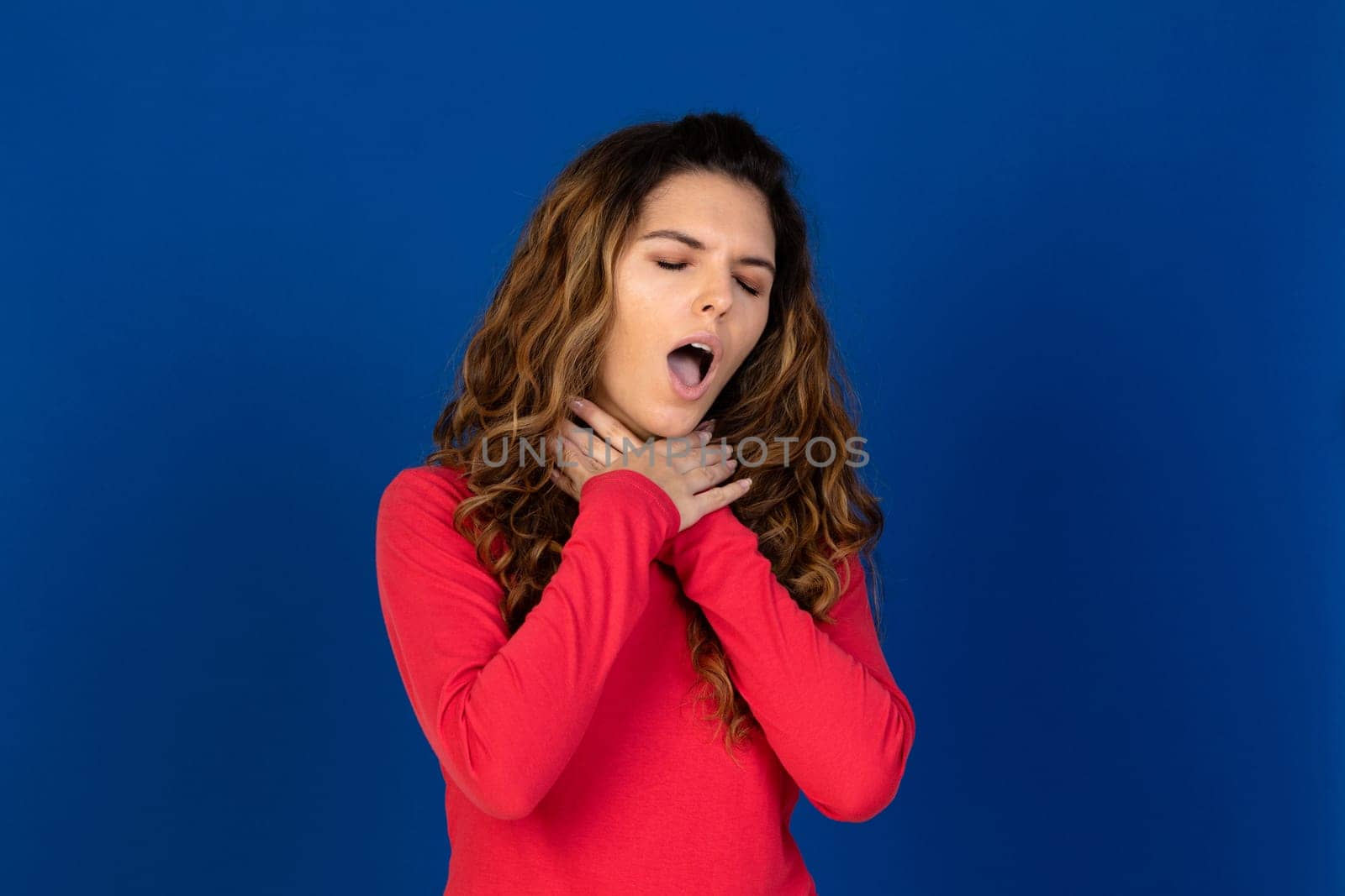 Portrait of beautiful caucasian girl with curly hair isolated on a white background
