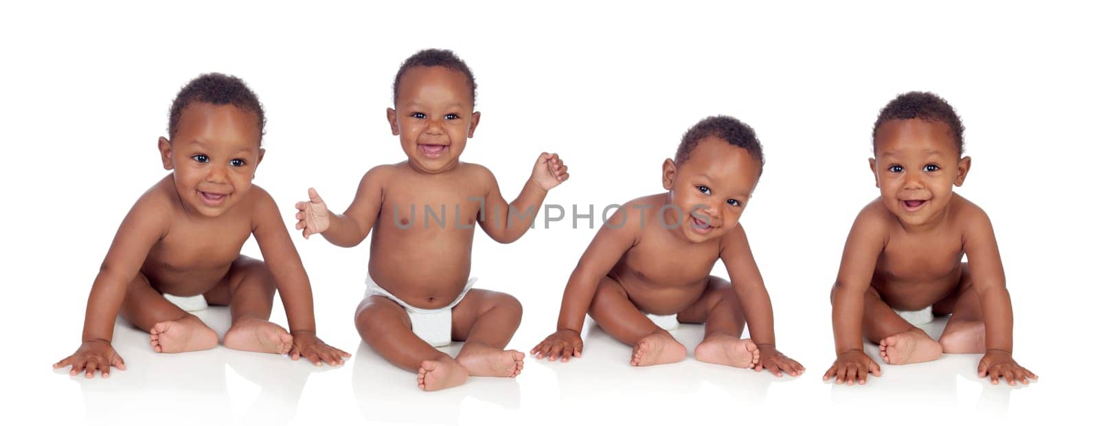 Four funny african baby sitting on the floor isolated on white background