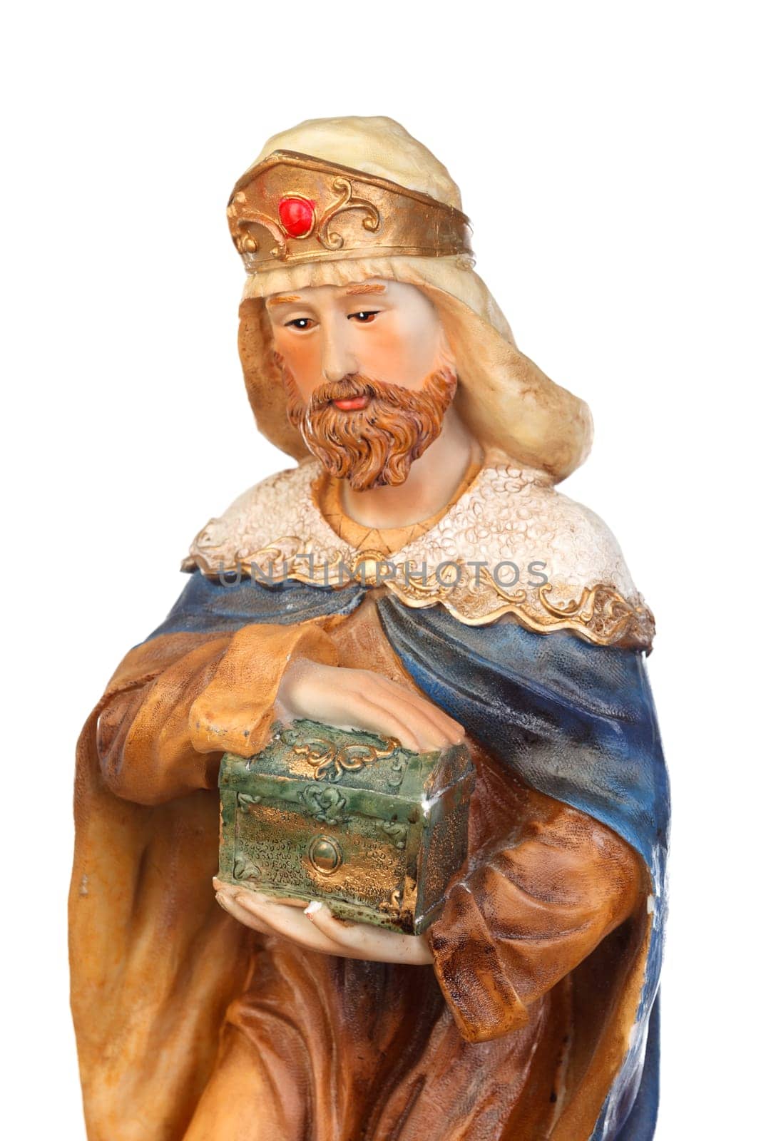 Melchor, one of the three wise men. Ceramic figure isolated on white background