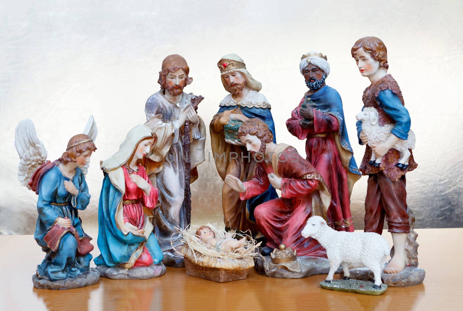 Nativity Scene on a wooden surface and a golden background