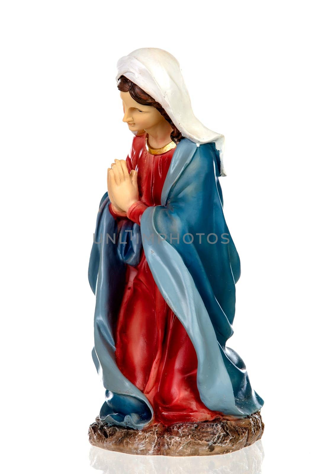 Ceramic figure of the virgin mary isolated on white background