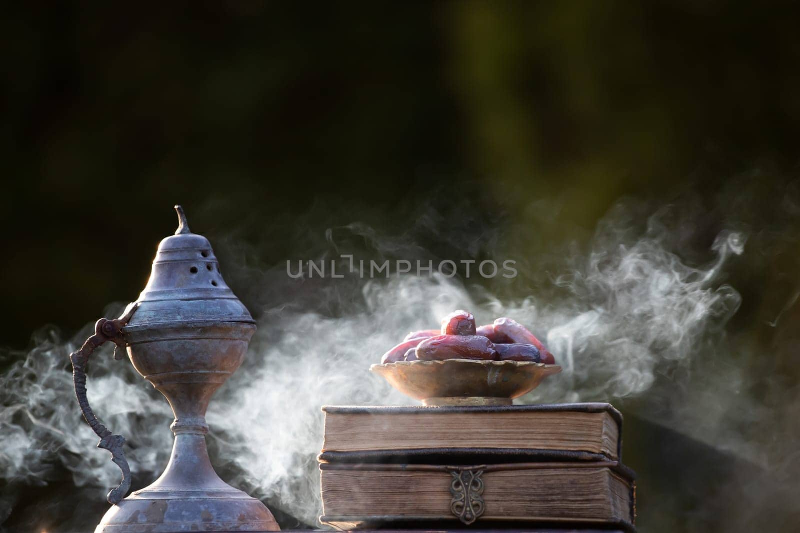 Festive greeting card for Muslim holy month Ramadan Kareem with dates, Quaran, censer and crescent moon.