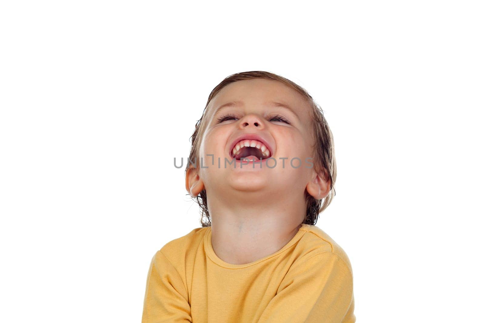 Adorable small child two years old with yellow t-shirt isolated on a white background