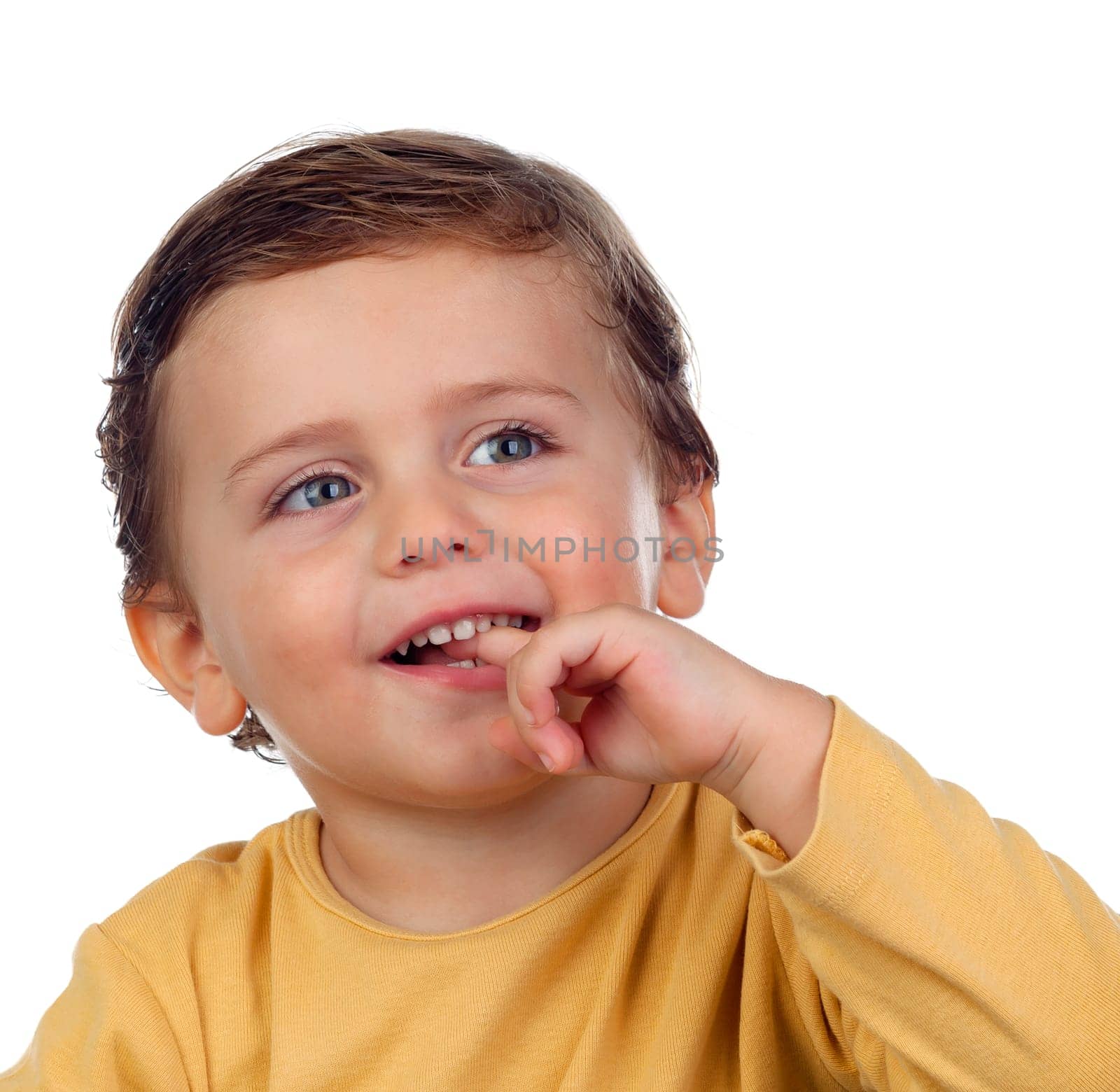 Adorable small child two years old sucking his hand