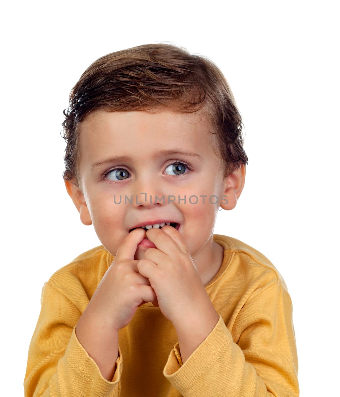 Adorable small child two years old sucking his hand