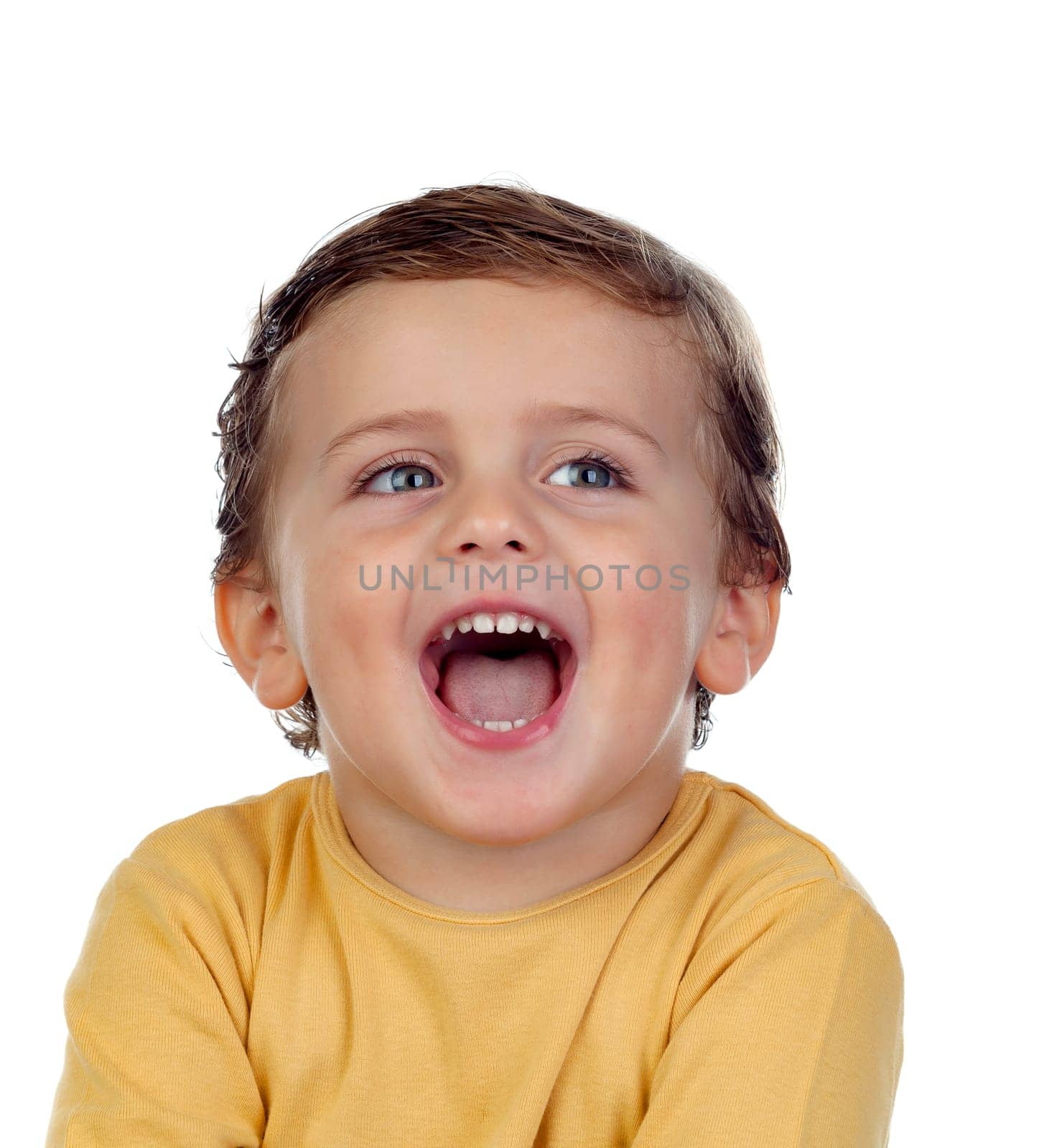 Adorable small child showing his tongue isolated on a white background