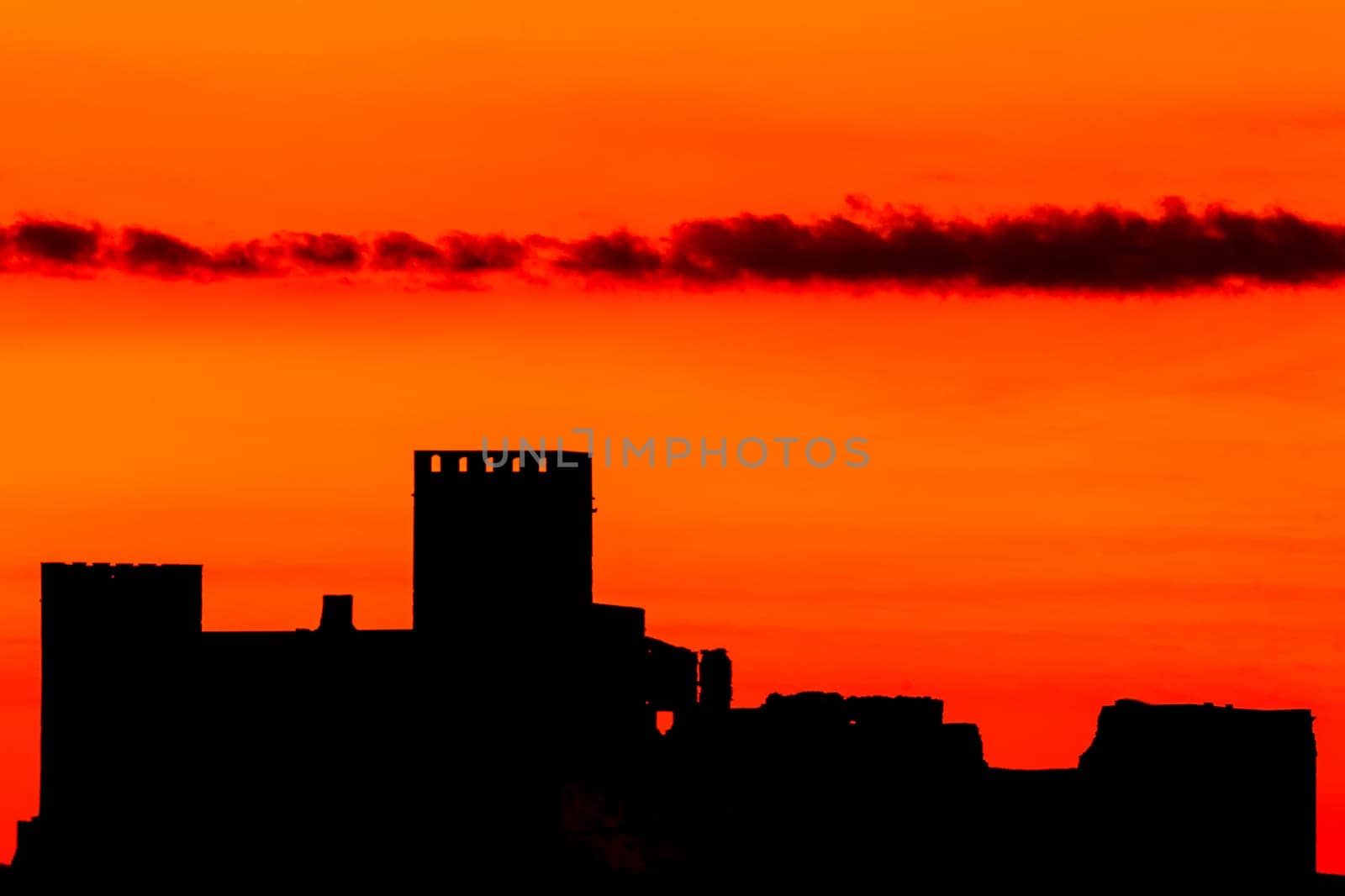 Silhouette of a amazing castle over a red sky