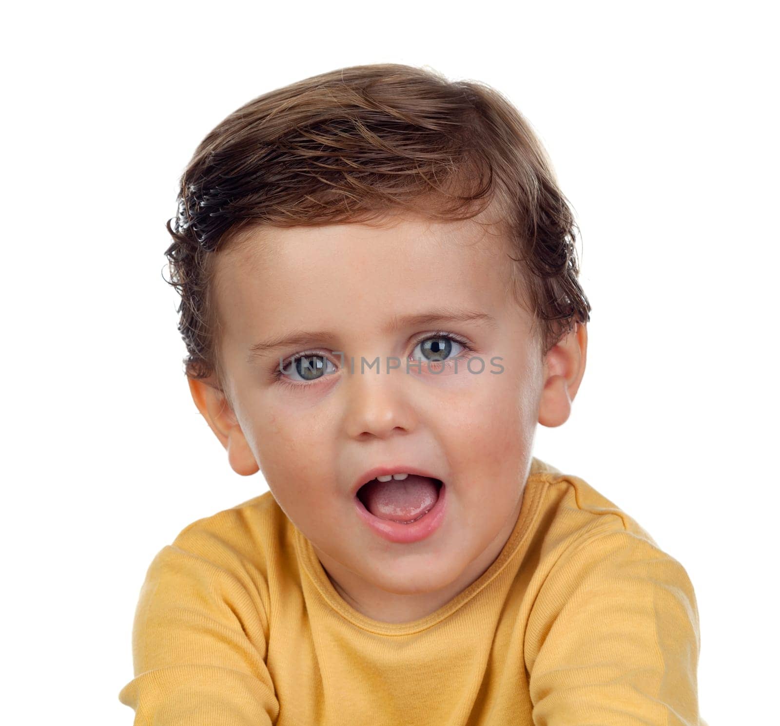 Adorable small child showing his tongue isolated on a white background