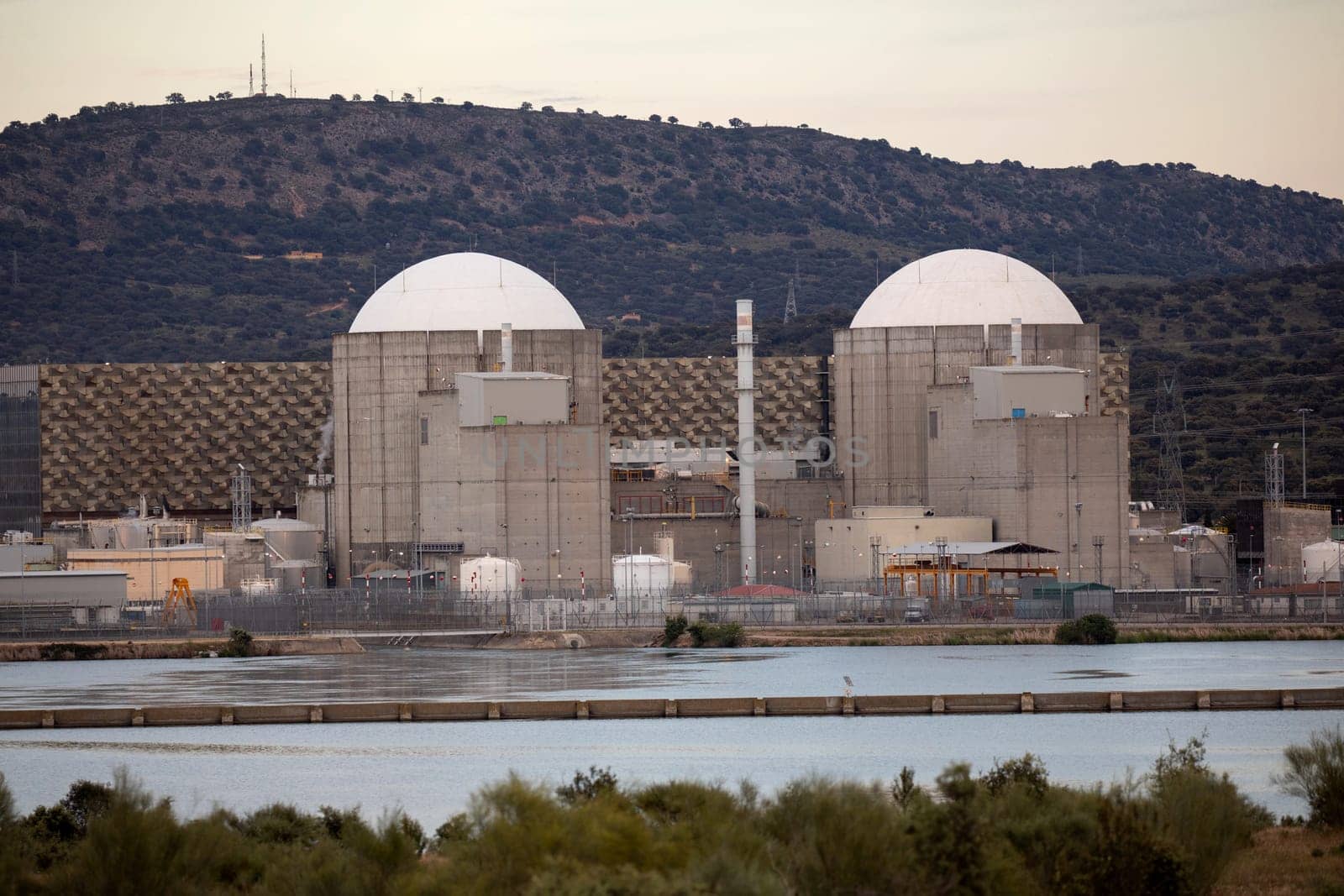 Almaraz, nuclear power plant in the center of Spain, surrounded by a green field