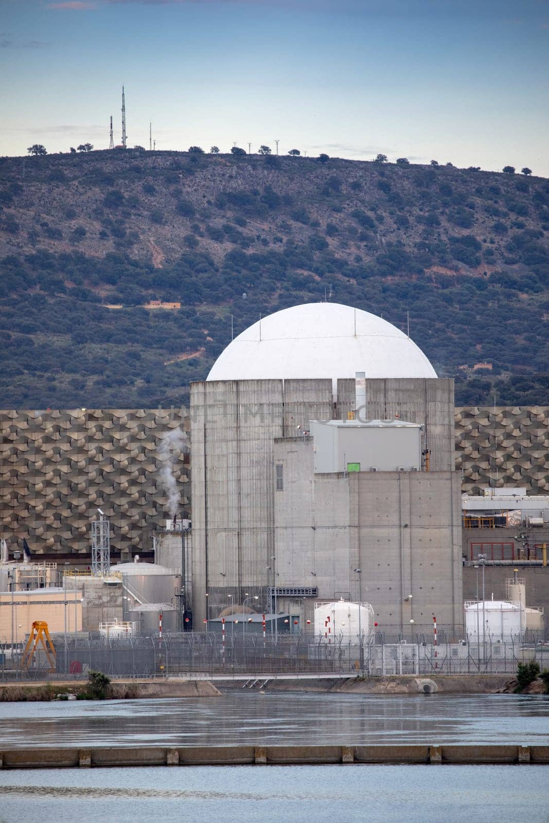 Almaraz, nuclear power plant in the center of Spain, surrounded by a green field