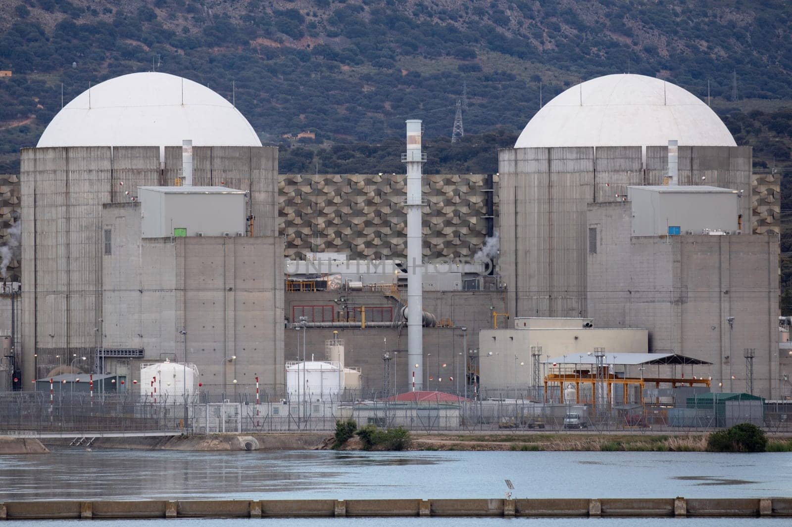 Almaraz, nuclear power plant in the center of Spain, surrounded by a green field