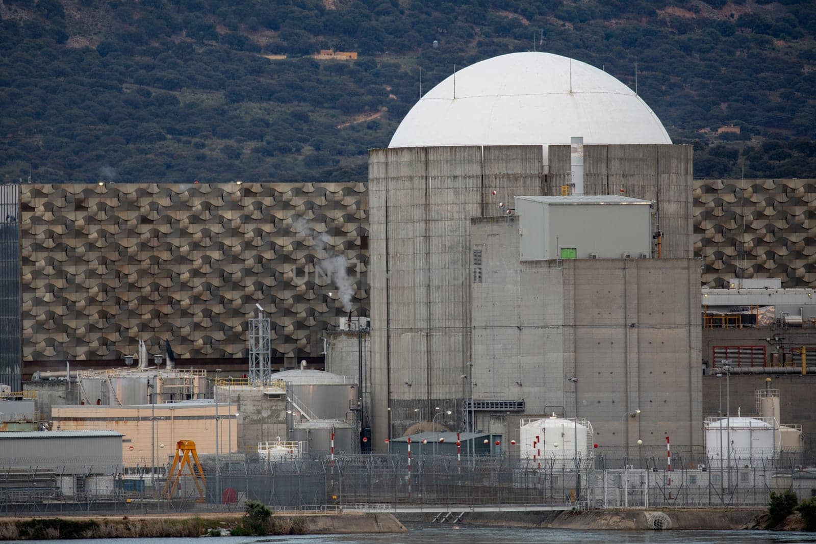 Almaraz, nuclear power plant in the center of Spain, surrounded by a green field