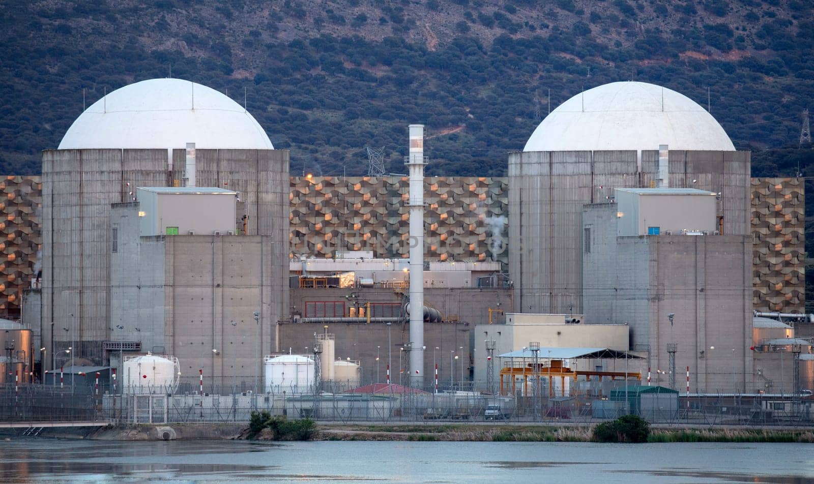 Almaraz, nuclear power plant in the center of Spain, surrounded by a green field