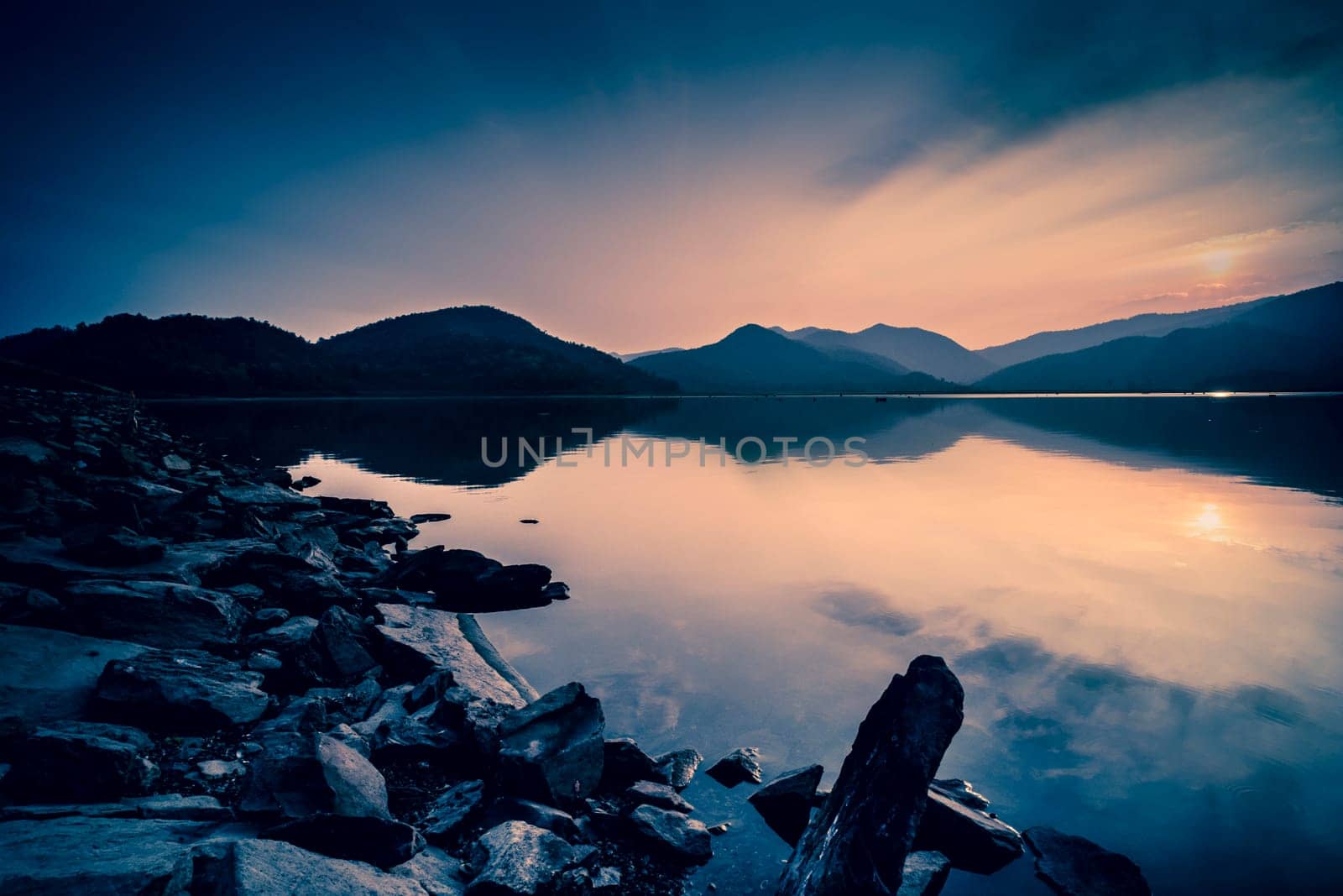 Beautiful Lake over the Mountains background Long Exposure. Travel place on good vacation time.