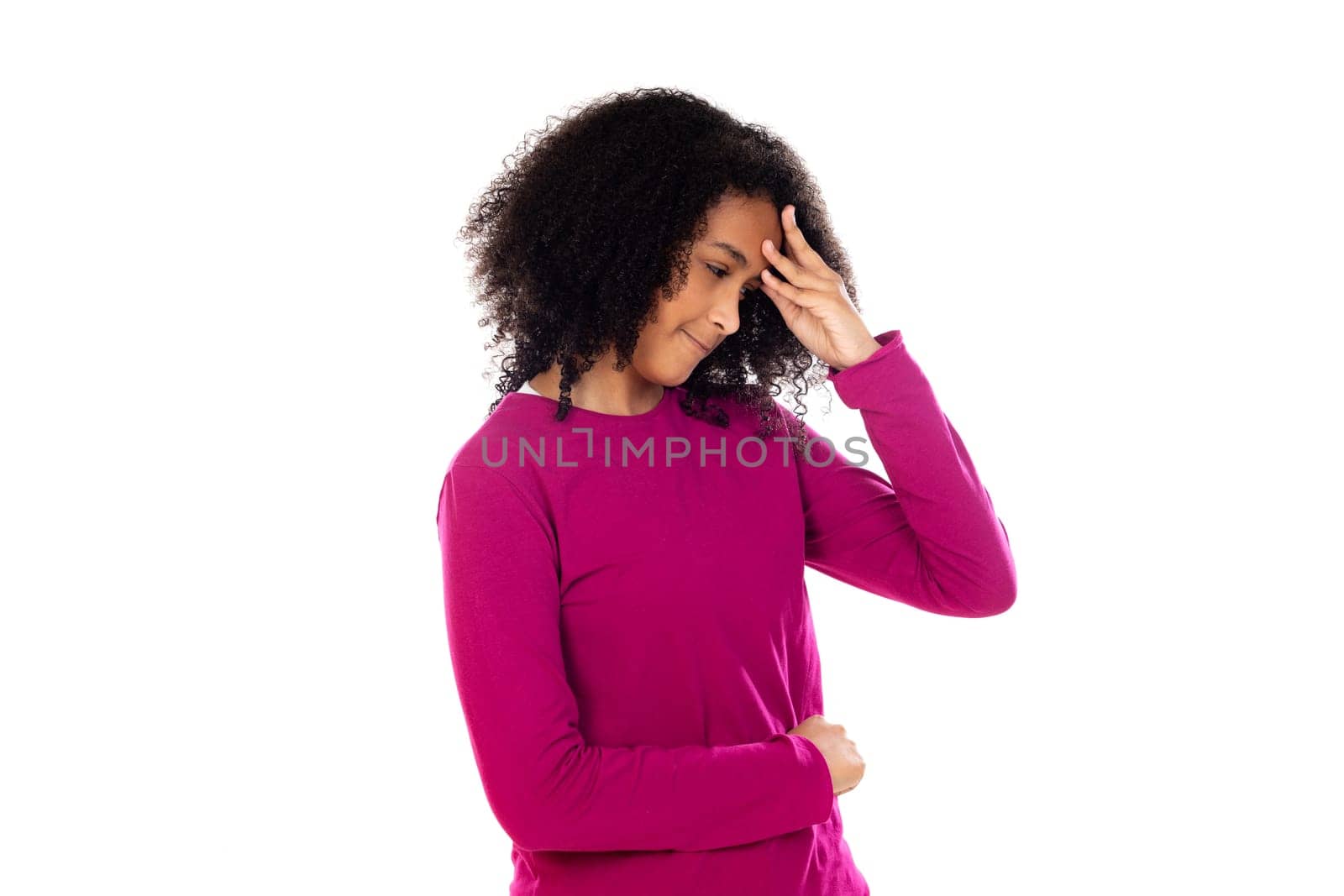 Beautiful teenager girl with pink sweater isolated on a white background