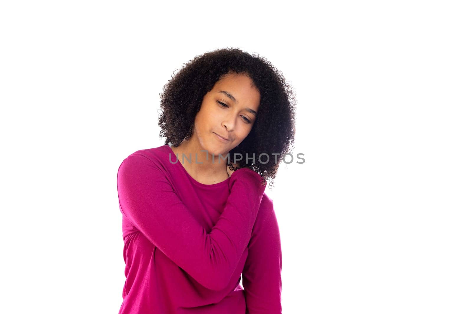 Teenager girl with afro hair wearing pink sweater isolated on a white background