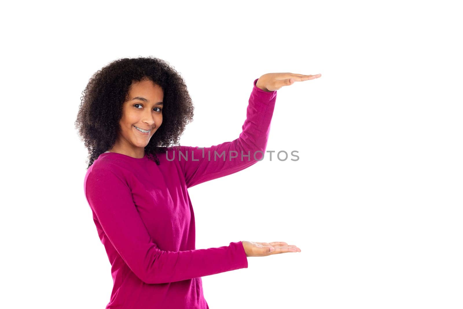 Teenager girl with afro hair wearing pink sweater isolated on a white background