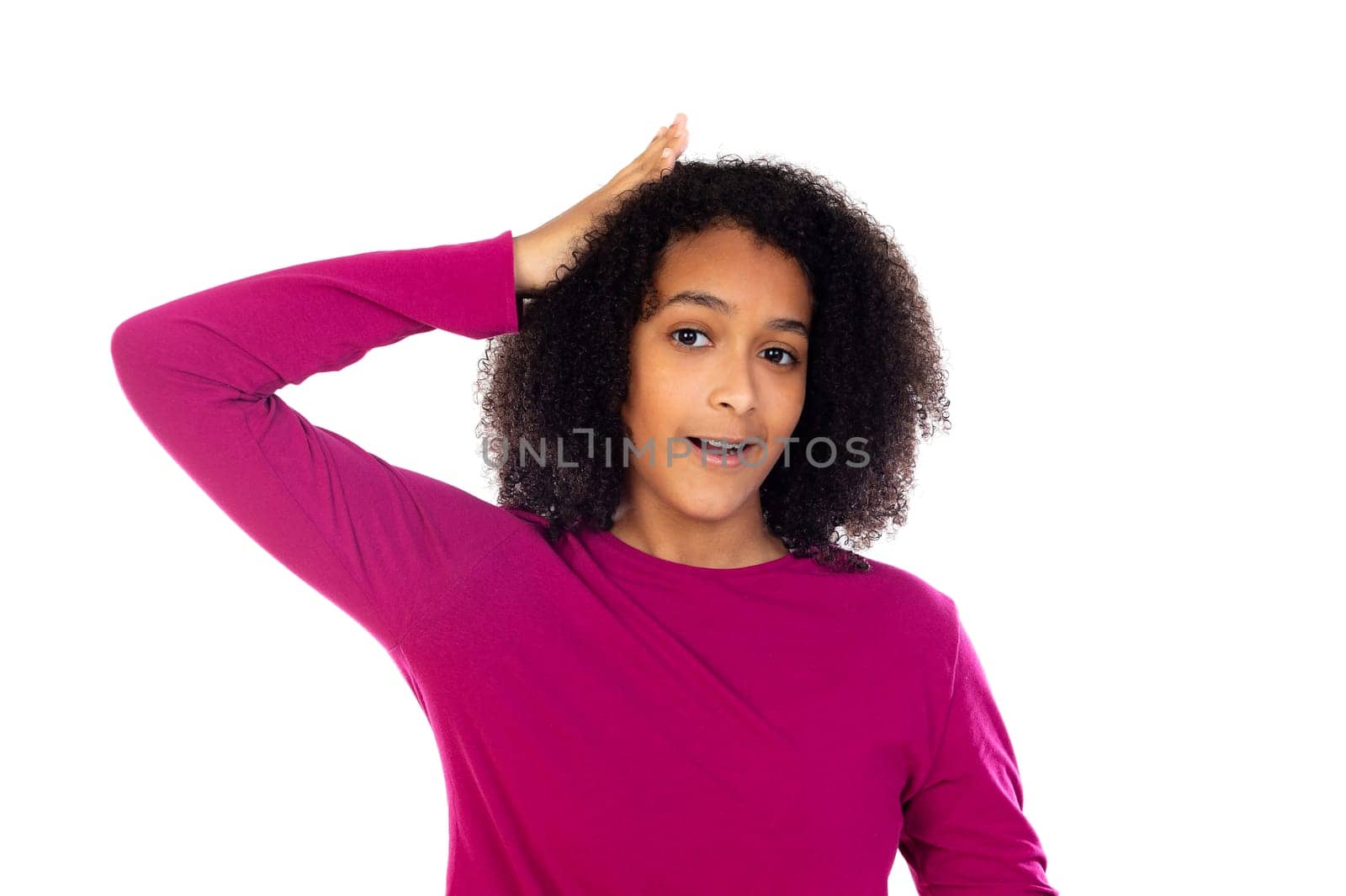 Teenager girl with afro hair wearing pink sweater isolated on a white background