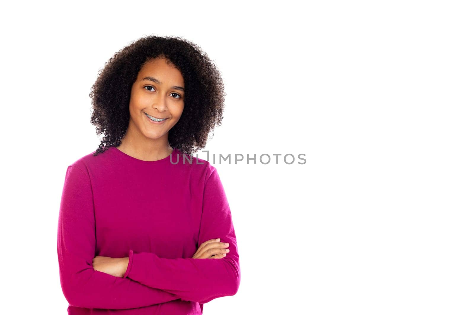 Beautiful teenager girl with pink sweater isolated on a white background