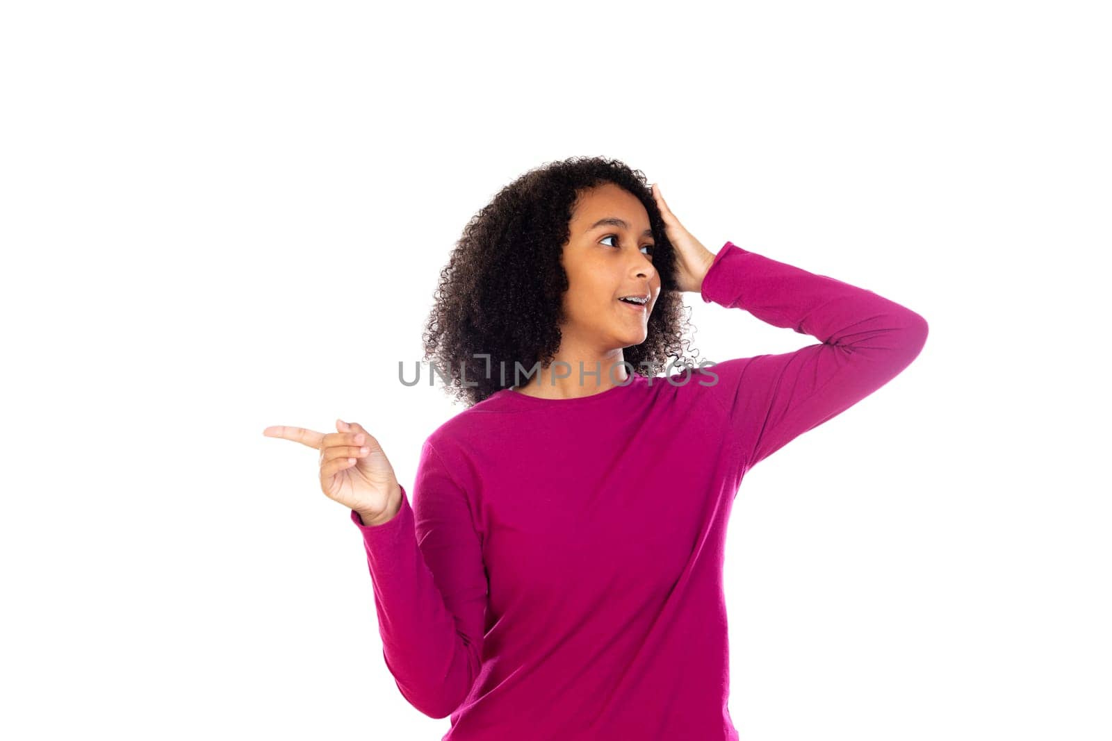 Beautiful teenager girl with pink sweater isolated on a white background