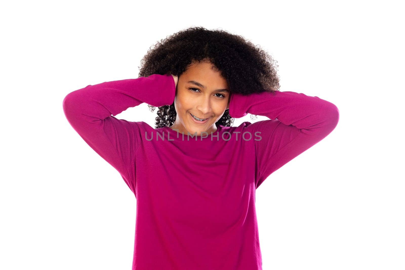 Beautiful teenager girl with pink sweater isolated on a white background