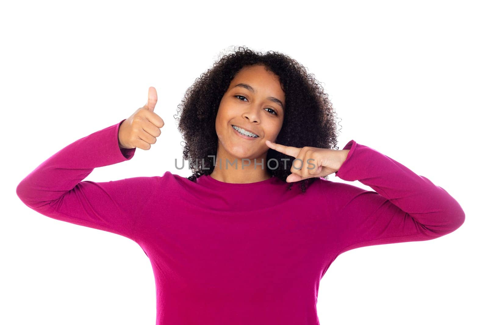 Beautiful teenager girl with dental braces isolated on a white background