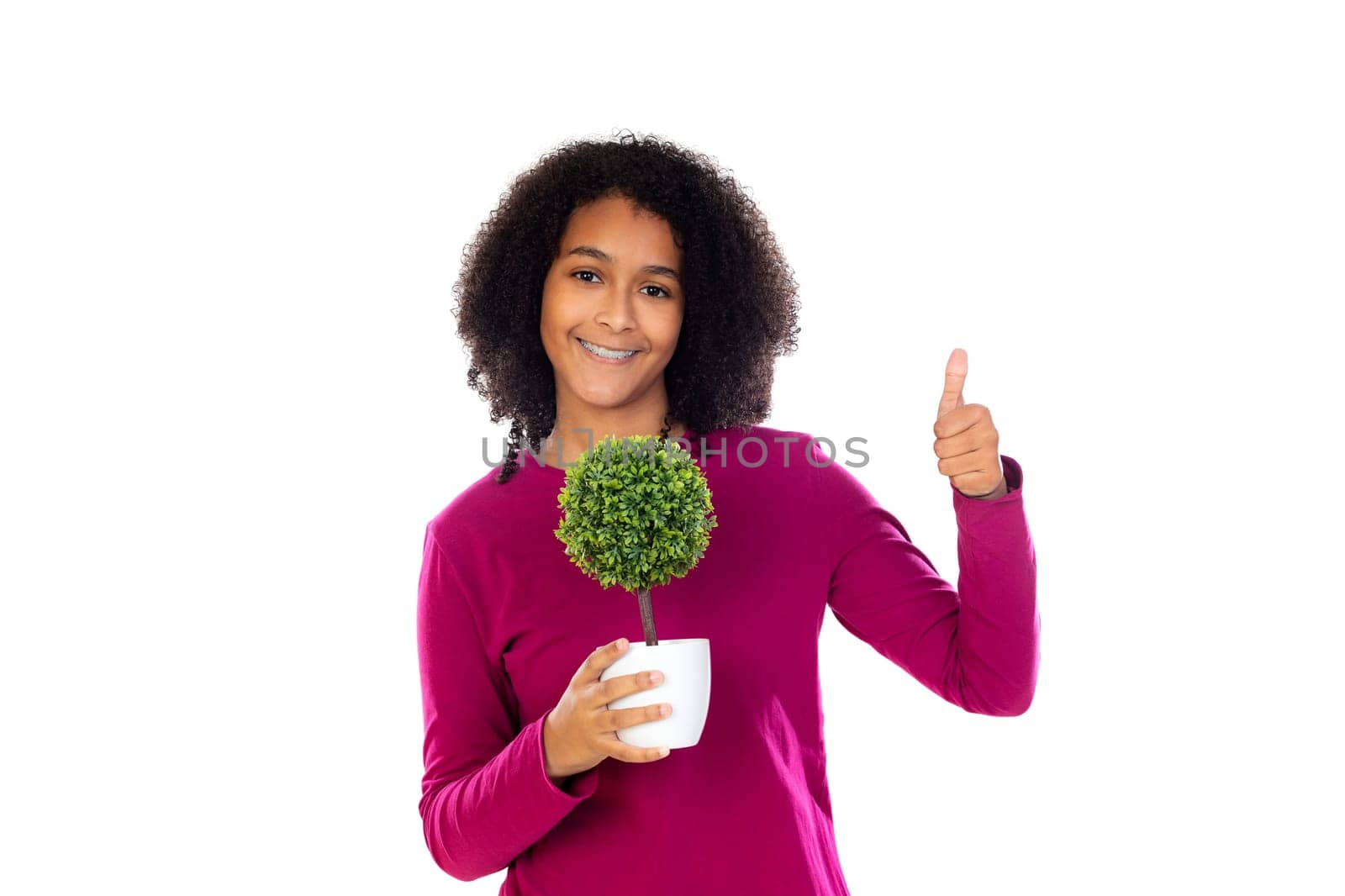 Teenager girl with afro hair wearing pink sweater isolated on a white background