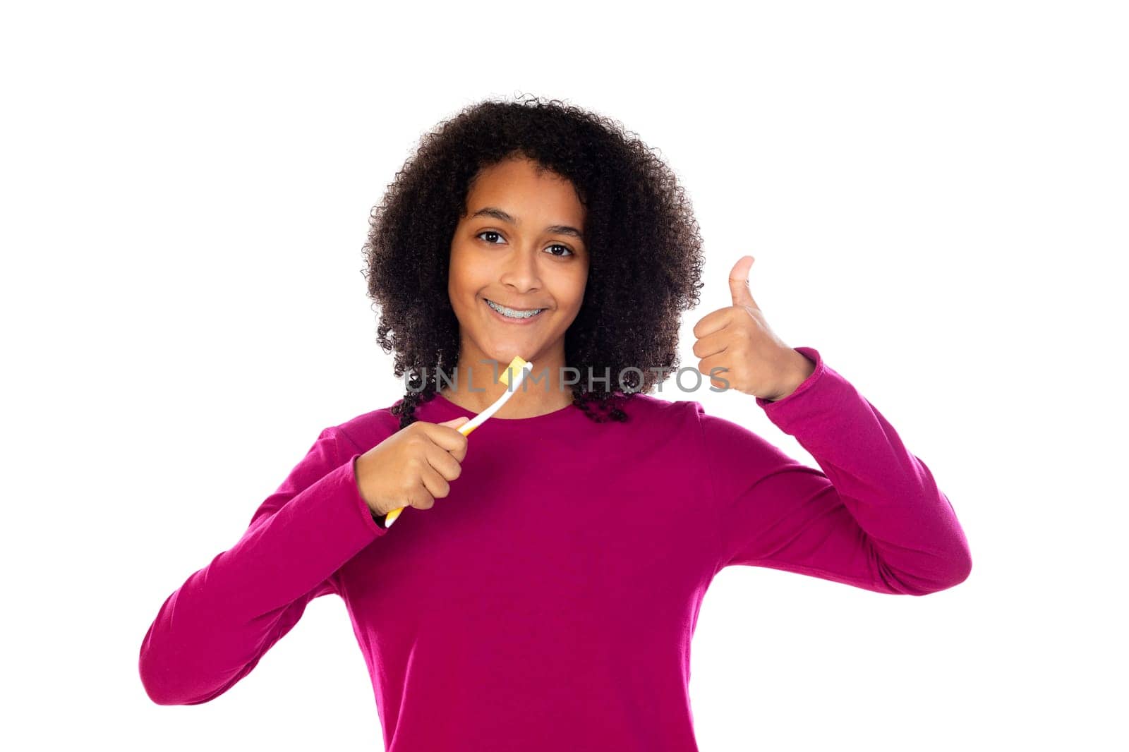 Teenager girl with afro hair wearing pink sweater isolated on a white background