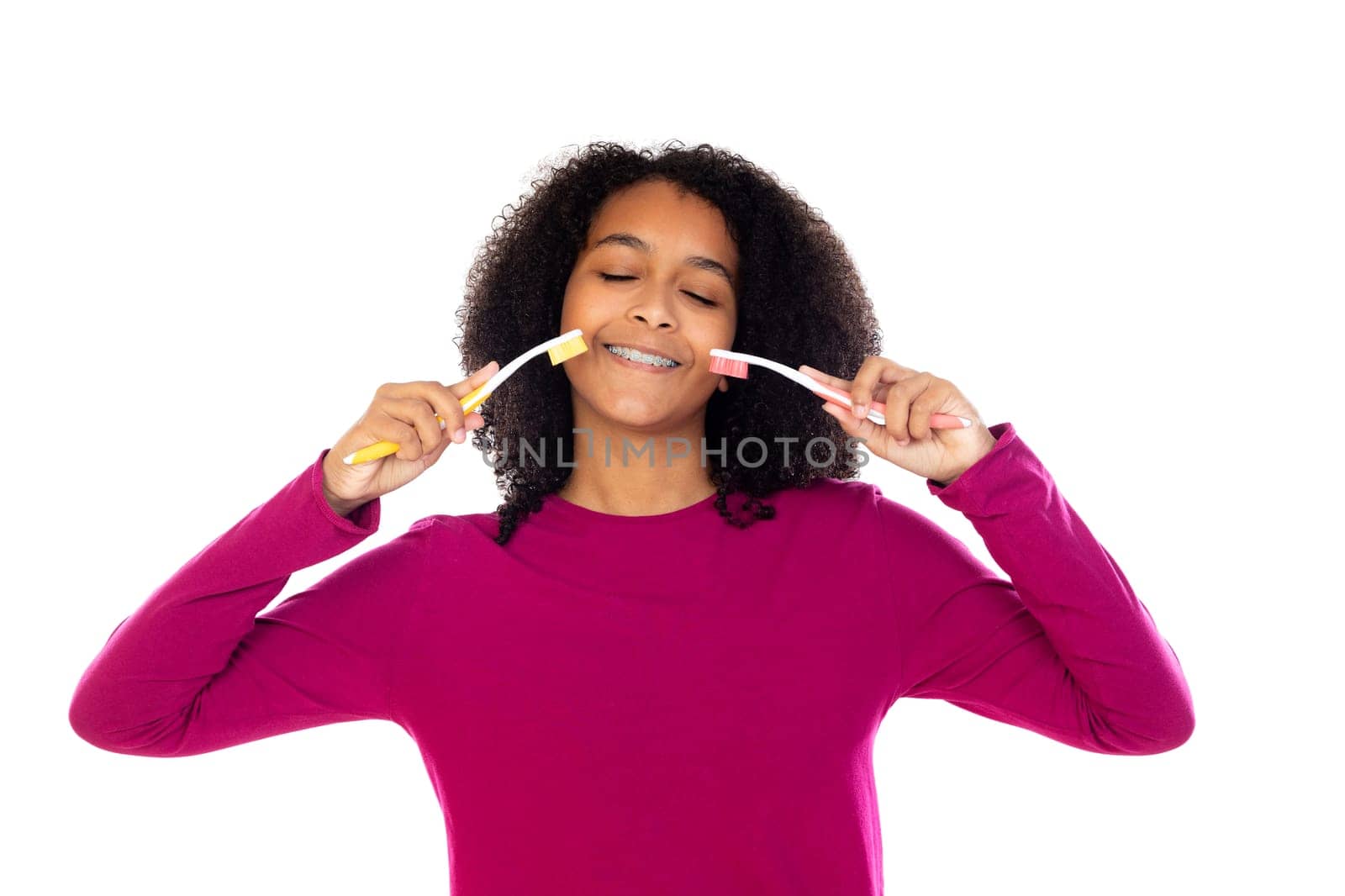 Teenager girl with afro hair wearing pink sweater isolated on a white background