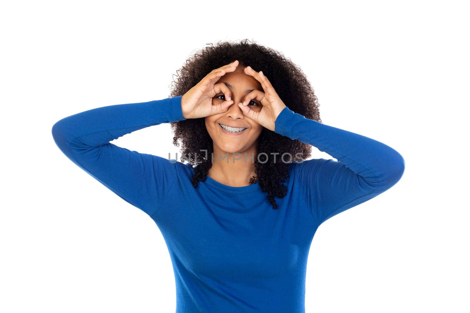 Teenager girl with afro hair wearing blue sweater isolated on a white background