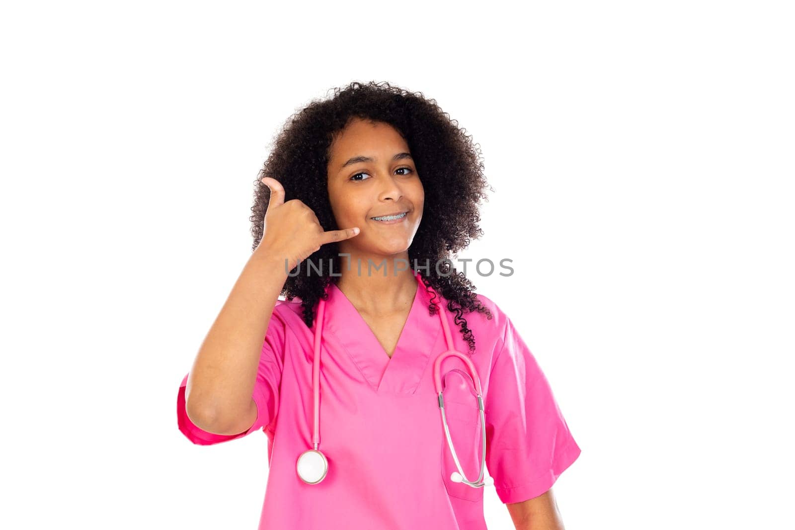 Adorable little doctor with pink uniform isolated on a white background