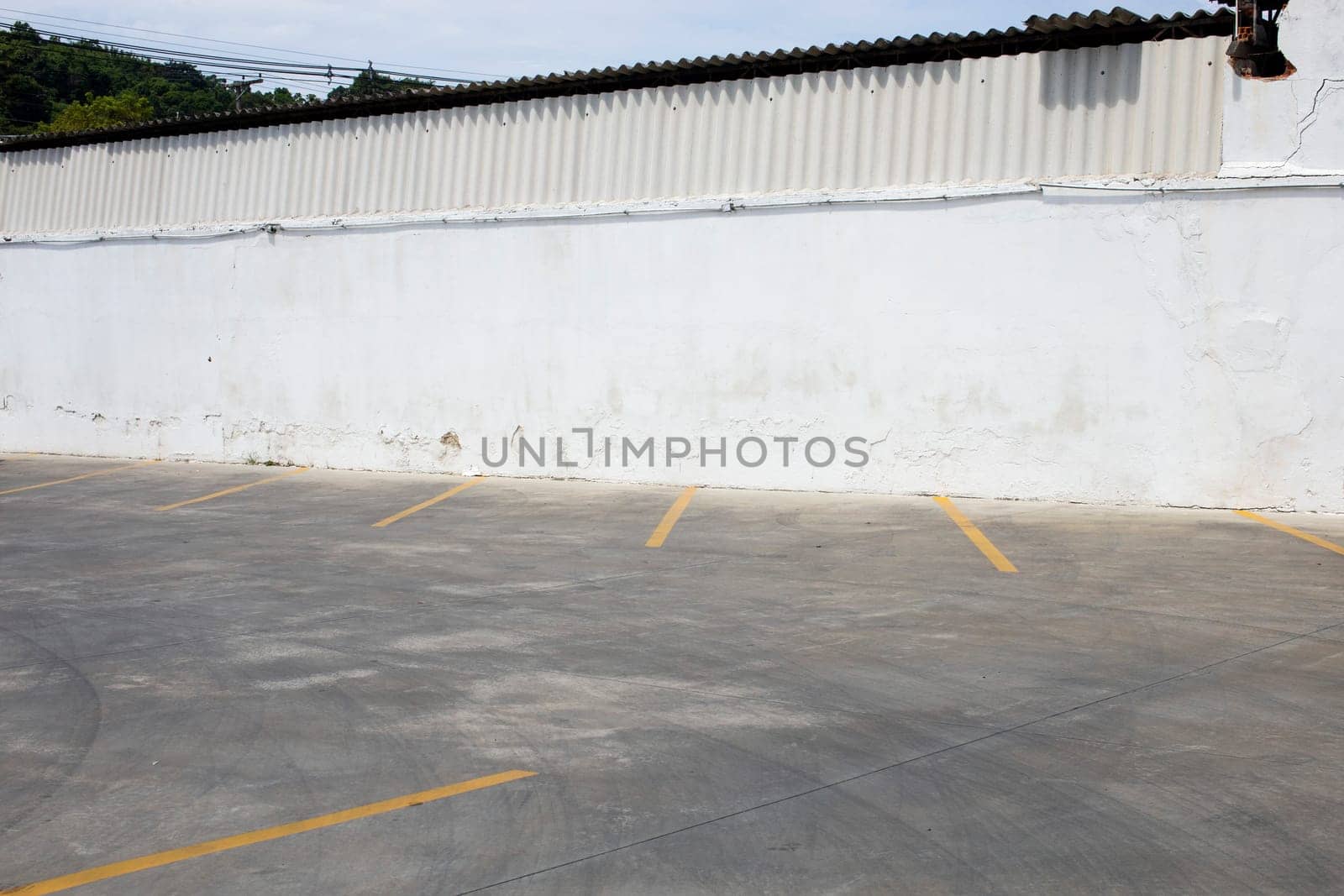 empty  parking lot white wall