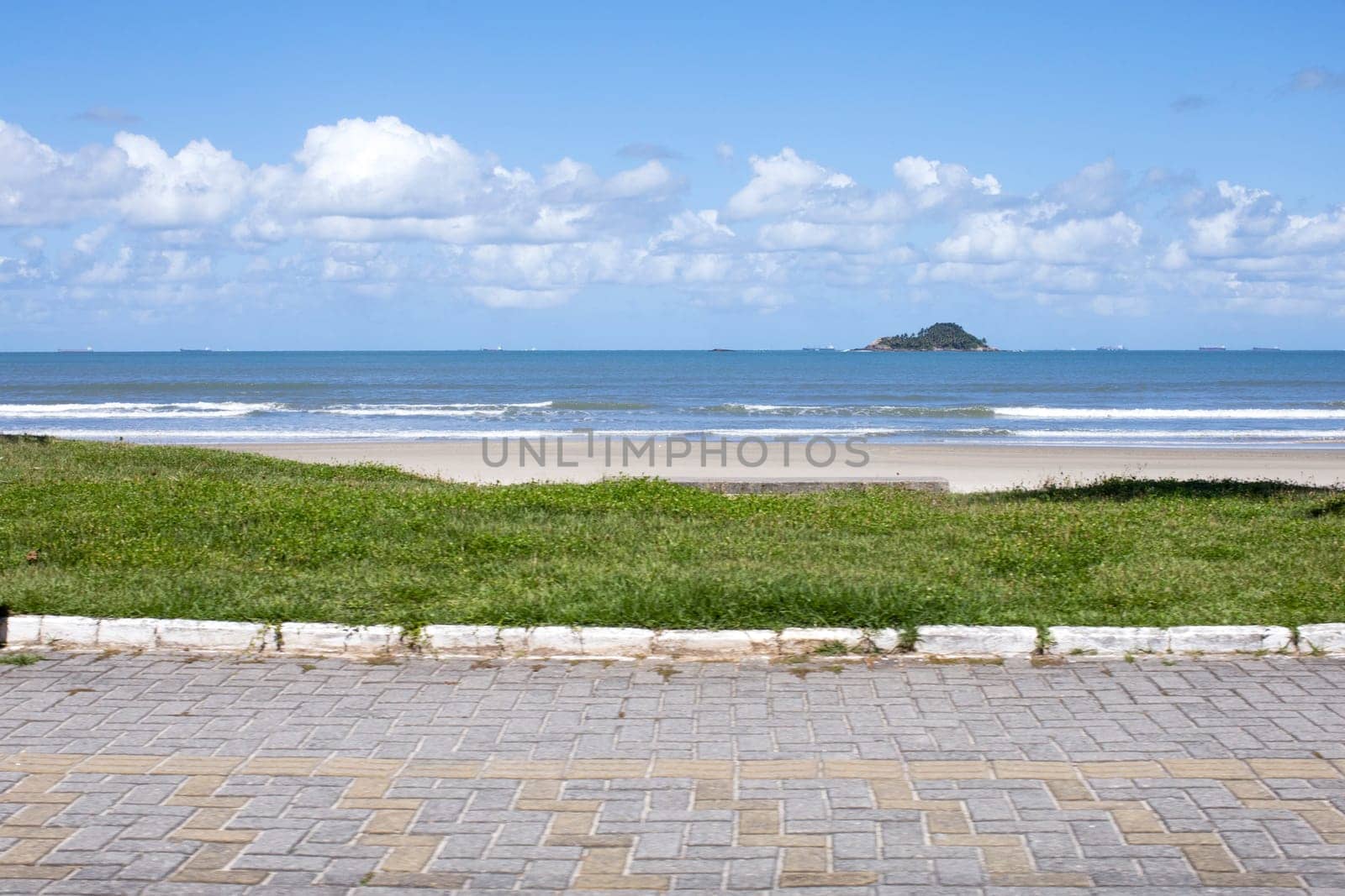 green grass empty beach Guaruja Brazil