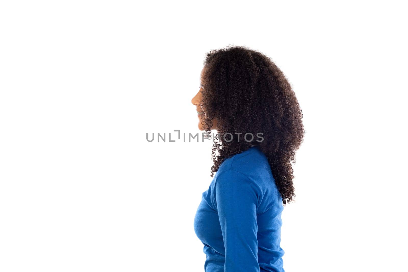 Teenager girl with afro hair wearing blue sweater isolated on a white background