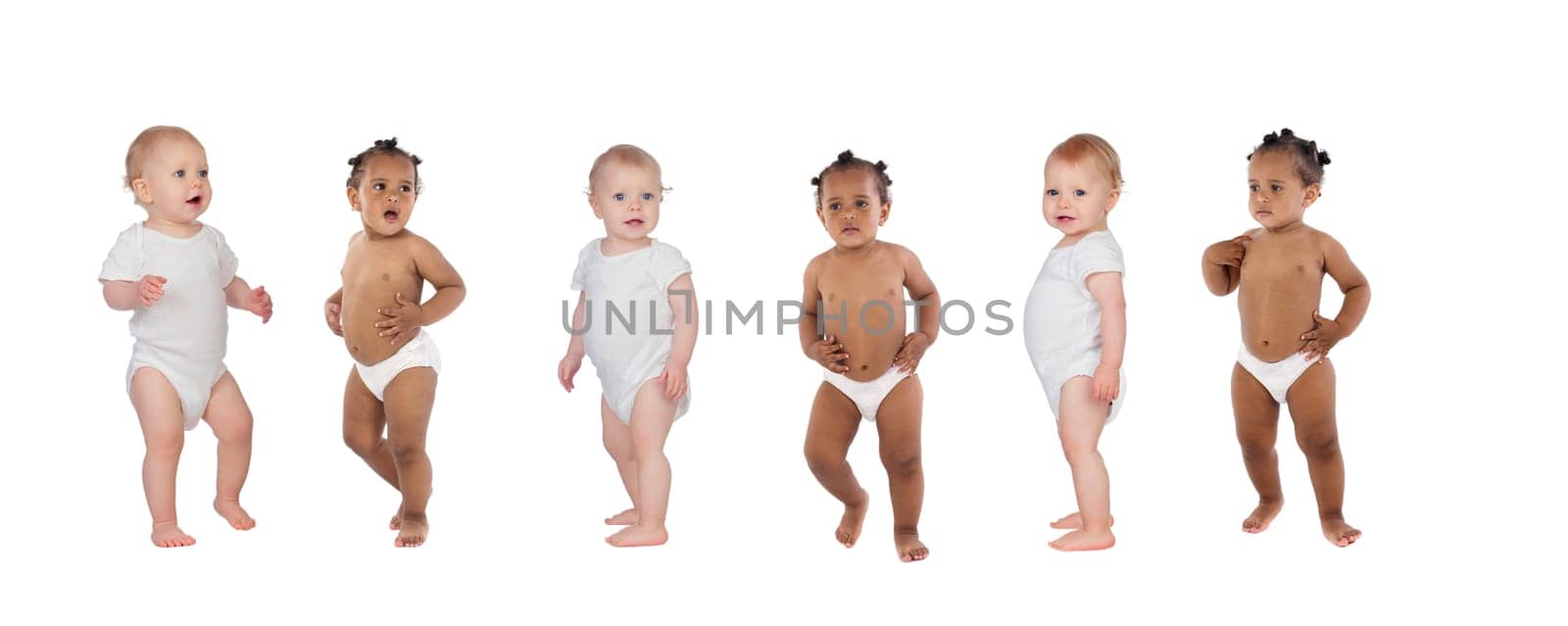 Beautiful babies in diaper standing up isolated on a white background