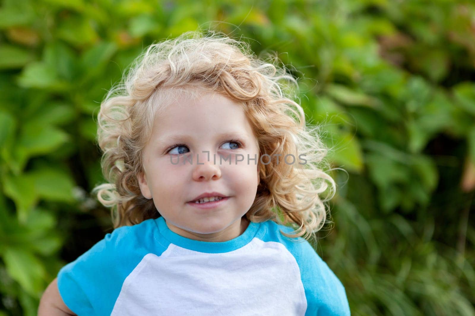 Beautiful boy four year old with long blond hair