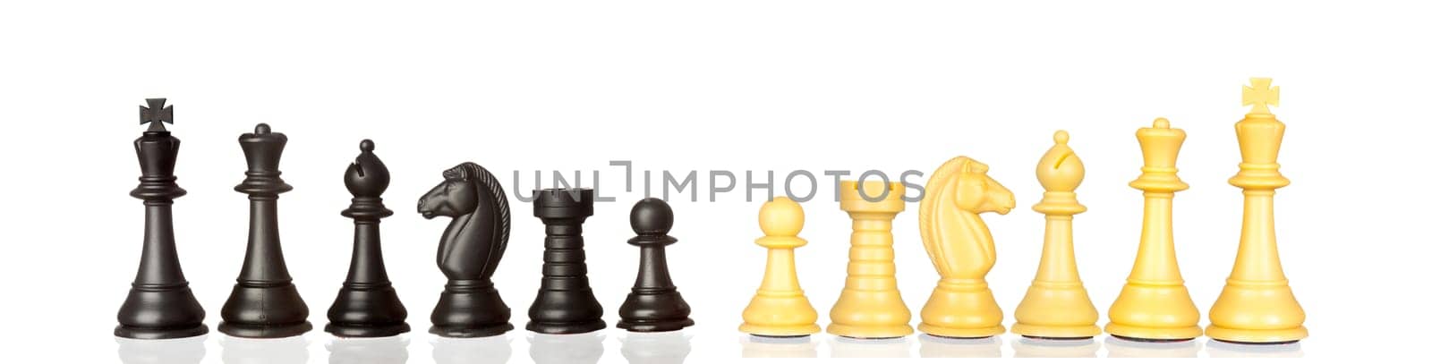 Set of black and white chess pieces isolated on a white background