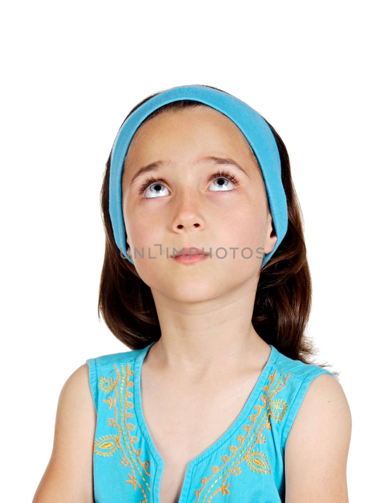 Beautiful pensive child with blue eyes isolated on a white background