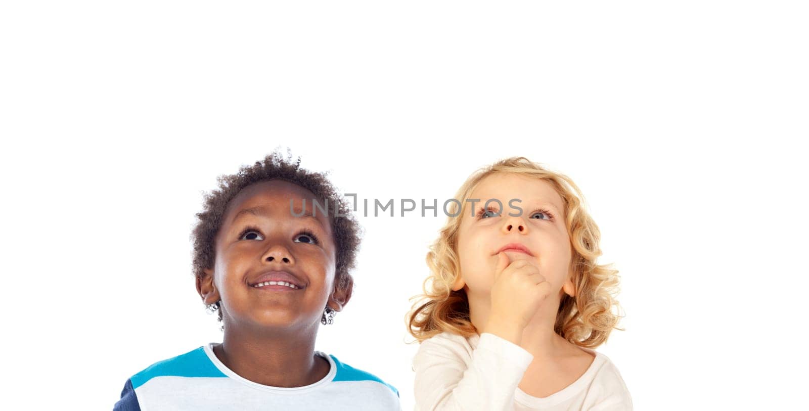 Two funny children looking up isolated on a white background